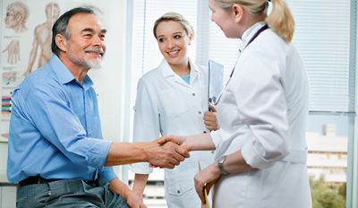 Doctor and translator meeting with patient